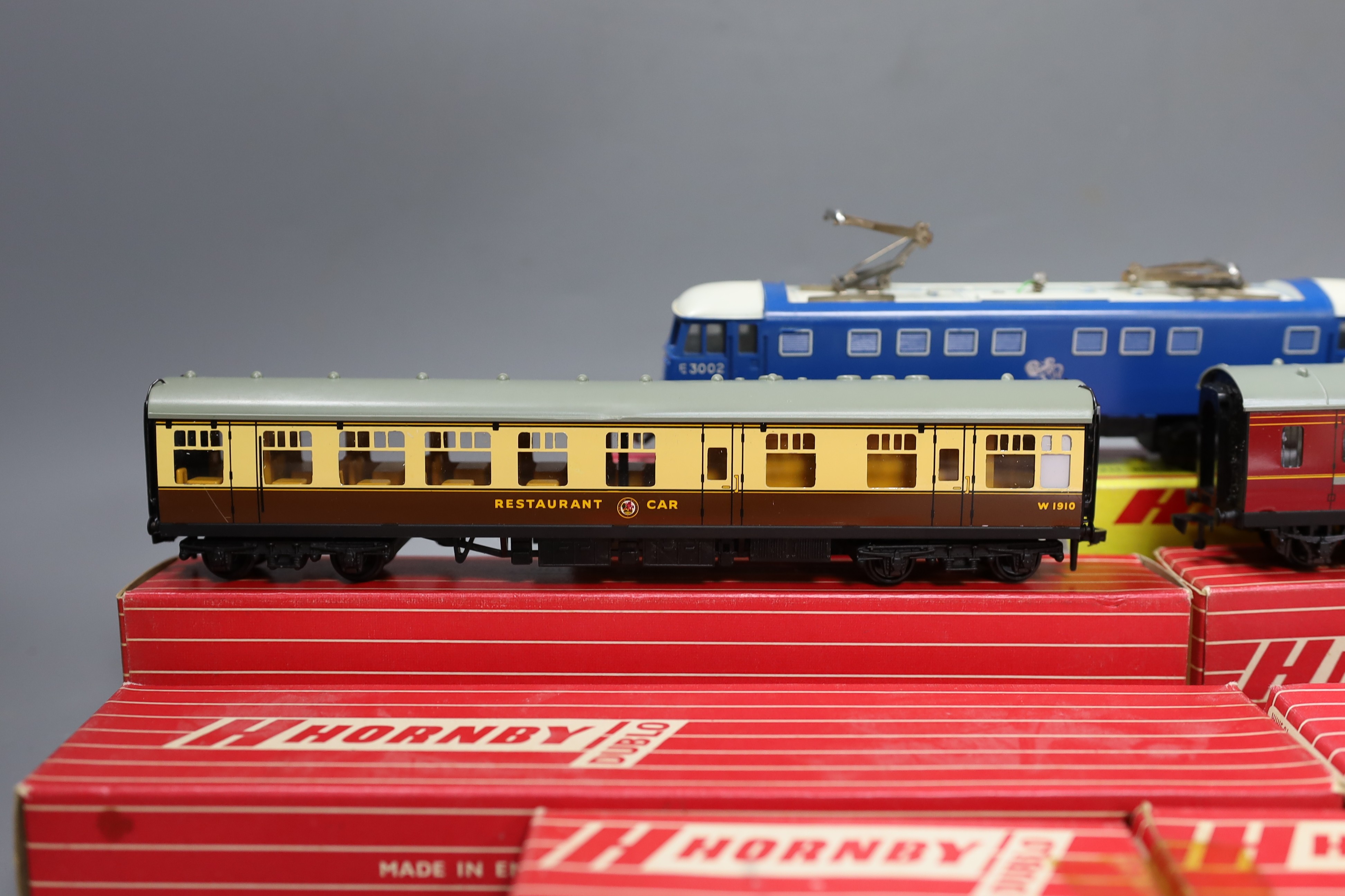 Rare boxed Hornby Dublo - 2245 3300 HP electric locomotive, 4070 and 4071 Restaurant Car, 4076 six wheeled passenger brake van and three empty Hornby boxes